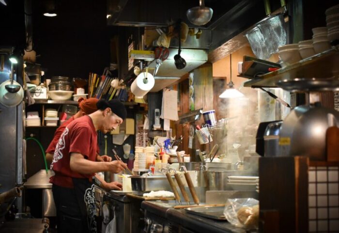 man cooking inside kitchen