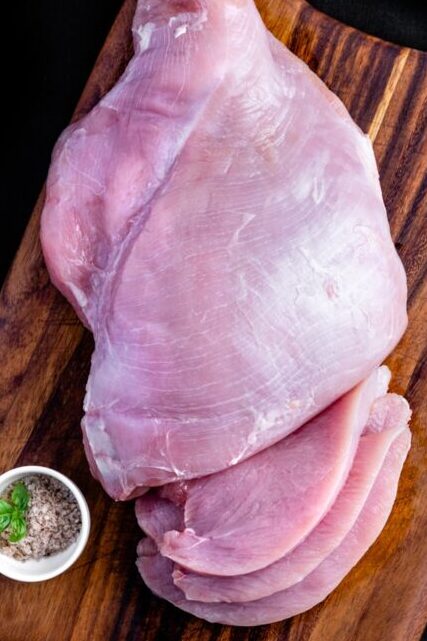 raw meat on brown wooden table